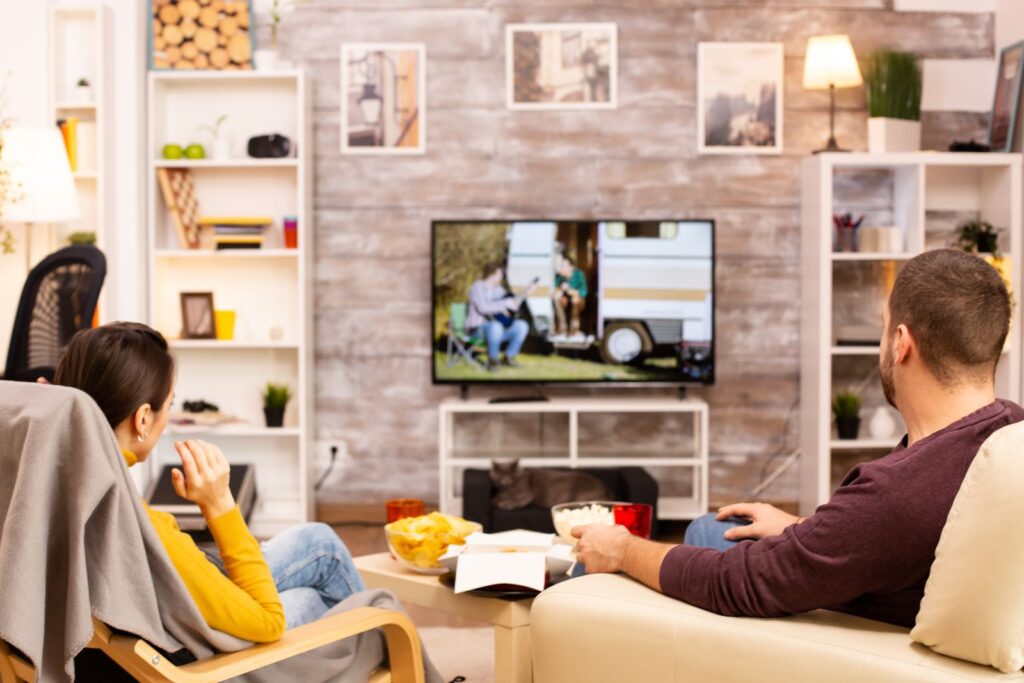 Couple watching a streaming TV commercial in their living room