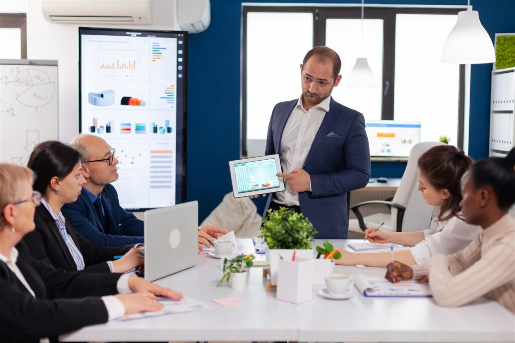 Leader briefing a team in a conference room